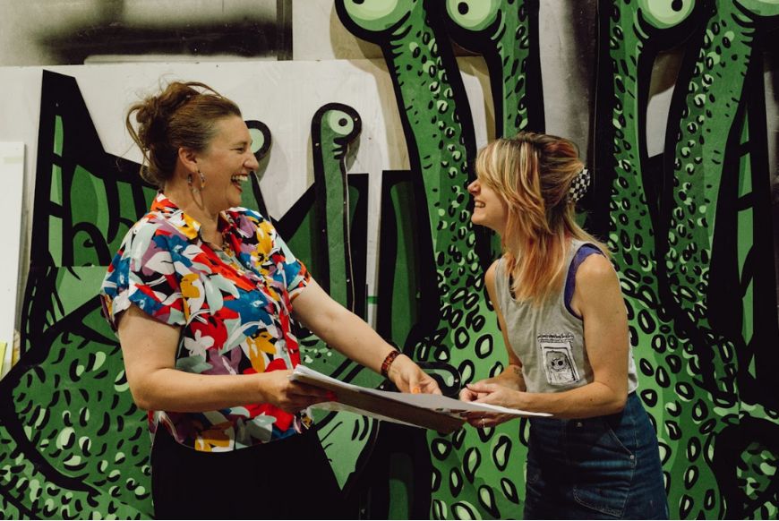 two women talking and laughing